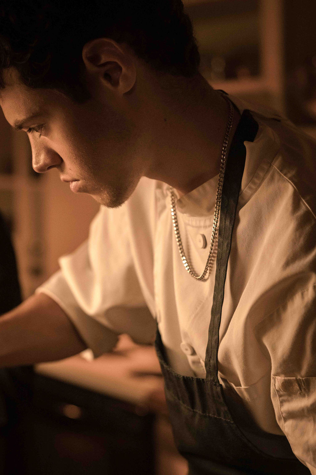 Chef Polka focused at work in the kitchen